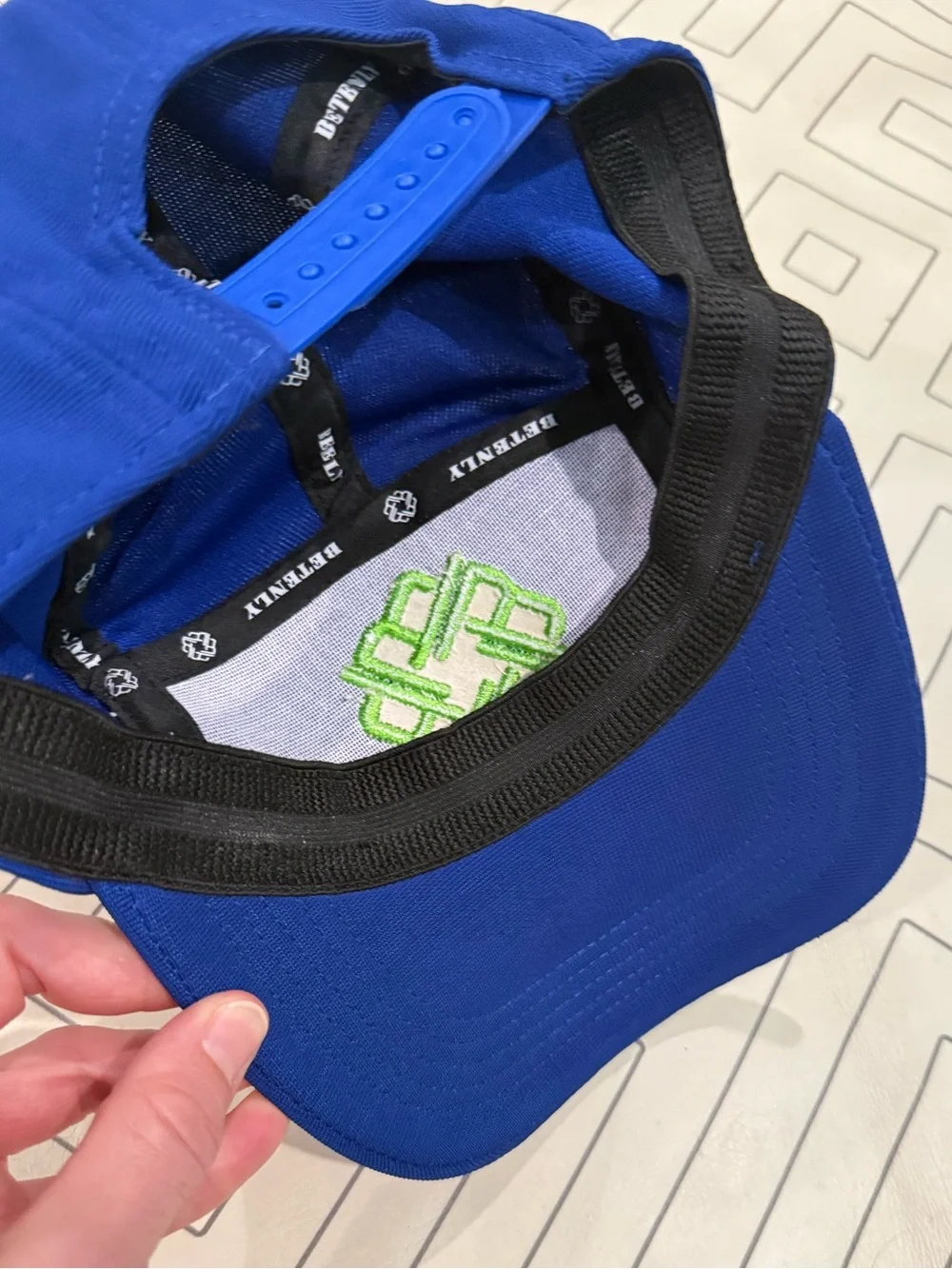 Betenly Blue Athletic Cap with Neon Green Knot Logo